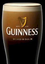 Glass of Guinness with etched harp logo