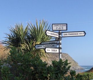 Direction signs pointing to places around the world. Located in Cape Clear, Ireland.