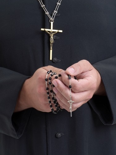 Rosary in RC priest's hands