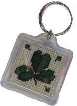 keyring with cross-stitched shamrock within.